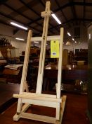 A SMALL TABLE TOP EASEL.