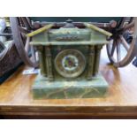 A VICTORIAN ONYX CASED MANTLE CLOCK.
