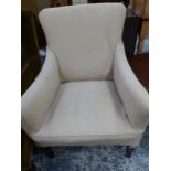 A SMALL EDWARDIAN UPHOLSTERED ARM CHAIR.