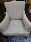 A SMALL EDWARDIAN UPHOLSTERED ARM CHAIR.