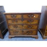 AN 18th C. MAHOGANY CHEST OF TWO SHORT AND THREE GRADED LONG DRAWERS BETWEEN GOTHIC BLIND FRET