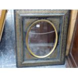 A LATE 19th CENTURY PICTURE FRAME WITH OVAL APERTURE.