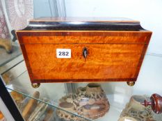 AN ANTIQUE REGENCY TEA CADDY