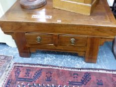 AN ORIENTAL HARDWOOD LOW TABLE WITH TWO DRAWERS.