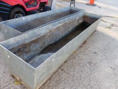 A PAIR OF LARGE GALVANISED STEEL WATER TROUGHS LENGTH 2020mm