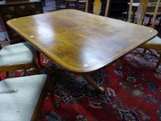 A 19th C. SATIN AND ROSEWOOD CROSS BANDED RECTANGULAR BREAKFAST TABLE TILTING ON A BALUSTER COLUMN