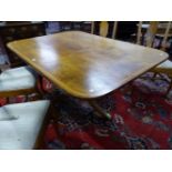 A 19th C. SATIN AND ROSEWOOD CROSS BANDED RECTANGULAR BREAKFAST TABLE TILTING ON A BALUSTER COLUMN