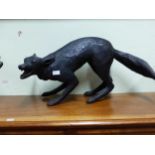 A DARK BROWN COMPOSITION MODEL OF A FOX BARKING AS IT STANDS. W 69cms.