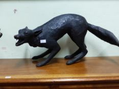 A DARK BROWN COMPOSITION MODEL OF A FOX BARKING AS IT STANDS. W 69cms.