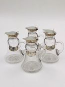 A SET OF FOUR SILVER AND GLASS WHISKY TOTS DATED 1924 BIRMINGHAM FOR HUKIN & HEATH LTD. TOGETHER