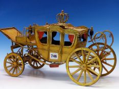 A SCALE TIN PLATE MODEL OF A ROYAL CORONATION COACH. LENGTH APPROX 43cms.