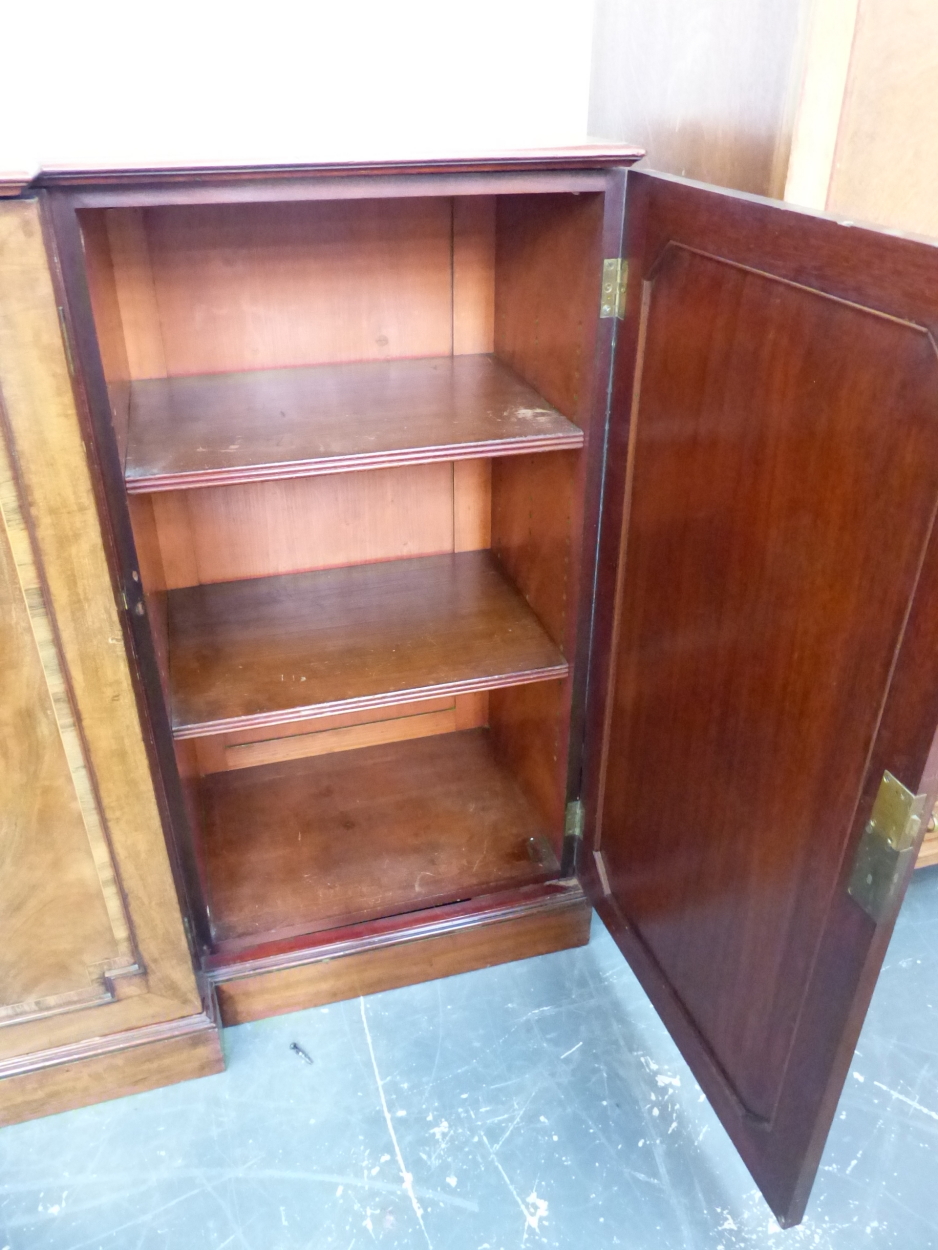 A 19th C. CROSS BANDED MAHOGANY BREAKFRONT BOOKCASE ON PLINTH FOOT. W 215 x D 46 x H 108cms. - Image 10 of 18