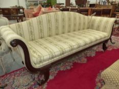 A 19th C. MAHOGANY SETTEE, THE ARCHED BACK AND SCROLL OUT ARMS UPHOLSTERED IN FLORAL STRIPED BEIGE