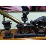 A 19th C. GRAND TOUR CLOCK GARNITURE, THE RED STONE ORNAMENTED BLACK SLATE CLOCK CASE SURMOUNTED BY