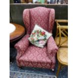 A LARGE ANTIQUE WINGBACK ARM CHAIR.