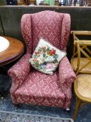 A LARGE ANTIQUE WINGBACK ARM CHAIR.