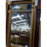 AN ANTIQUE GILT MIRROR WITH EGLOMISE PANEL. 69 x 36cms TOGETHER WITH A VICTORIAN VERSE SAMPLER DATED