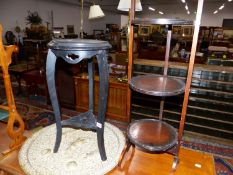 A FOLDING CAKE STAND, A LARGE EASTERN BRASS TRAY AND AN ORIENTAL POT STAND.