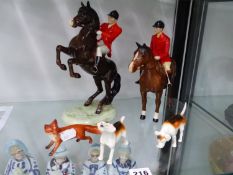 TWO BESWICK HUNTSMEN, TWO HOUNDS AND THE FOX