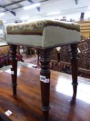 A 19th C. MAHOGANY STOOL WITH FLORAL NEEDLEWORK SEAT, THE TOPS OF THE TAPERING CYLINDRICAL LEGS RING