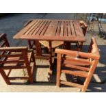 A LISTER GARDEN TABLE AND FOUR CHAIRS