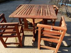 A LISTER GARDEN TABLE AND FOUR CHAIRS