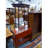 A TEA TROLLEY AND A MAHOGANY OVAL OCCASIONAL TABLE.