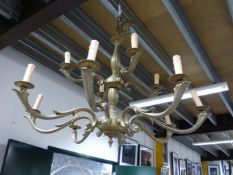 A 19th C. STYLE BRASS CHANDELIER, THE REEDED COLUMN SUPPORTING A TIER OF FOUR BRANCHES OF ELECTRIC