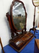 A LARGE VICTORIAN MAHOGANY DRESSING TABLE MIRROR AND A POLE SCREEN WITH NEEDLE WORK PANEL.