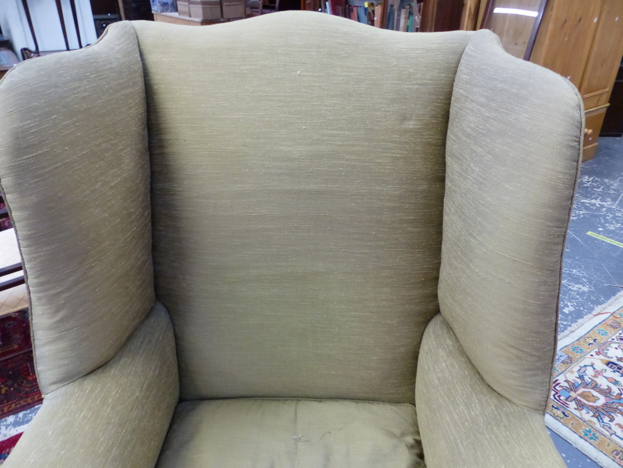 A 19th C. WING ARMCHAIR UPHOLSTERED IN OLIVE GREEN, THE CABRIOLE FRONT LEGS CARVED WITH LEAVES AT - Image 4 of 13