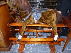 A LARGE VINTAGE ROCKING HORSE.