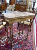 A LATE ANTIQUE MAHOGANY CROSS BANDED BURR YEW FLAP TOP TABLE OPENING ON A SINGLE GATE, THE LEGS