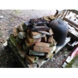 AN ANTIQUE CAST IRON COPPER WITH BRICK SURROUND AND A STONE SUNDIAL BASE.