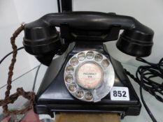 A VINTAGE BAKELITE TELEPHONE WITH DRAWER BASE, TOGETHER WITH ONE OTHER.