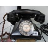 A VINTAGE BAKELITE TELEPHONE WITH DRAWER BASE, TOGETHER WITH ONE OTHER.