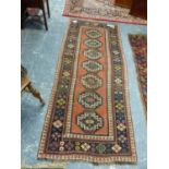 AN ANTIQUE CAUCASIAN KAZAK RUG. 236 x 98cms