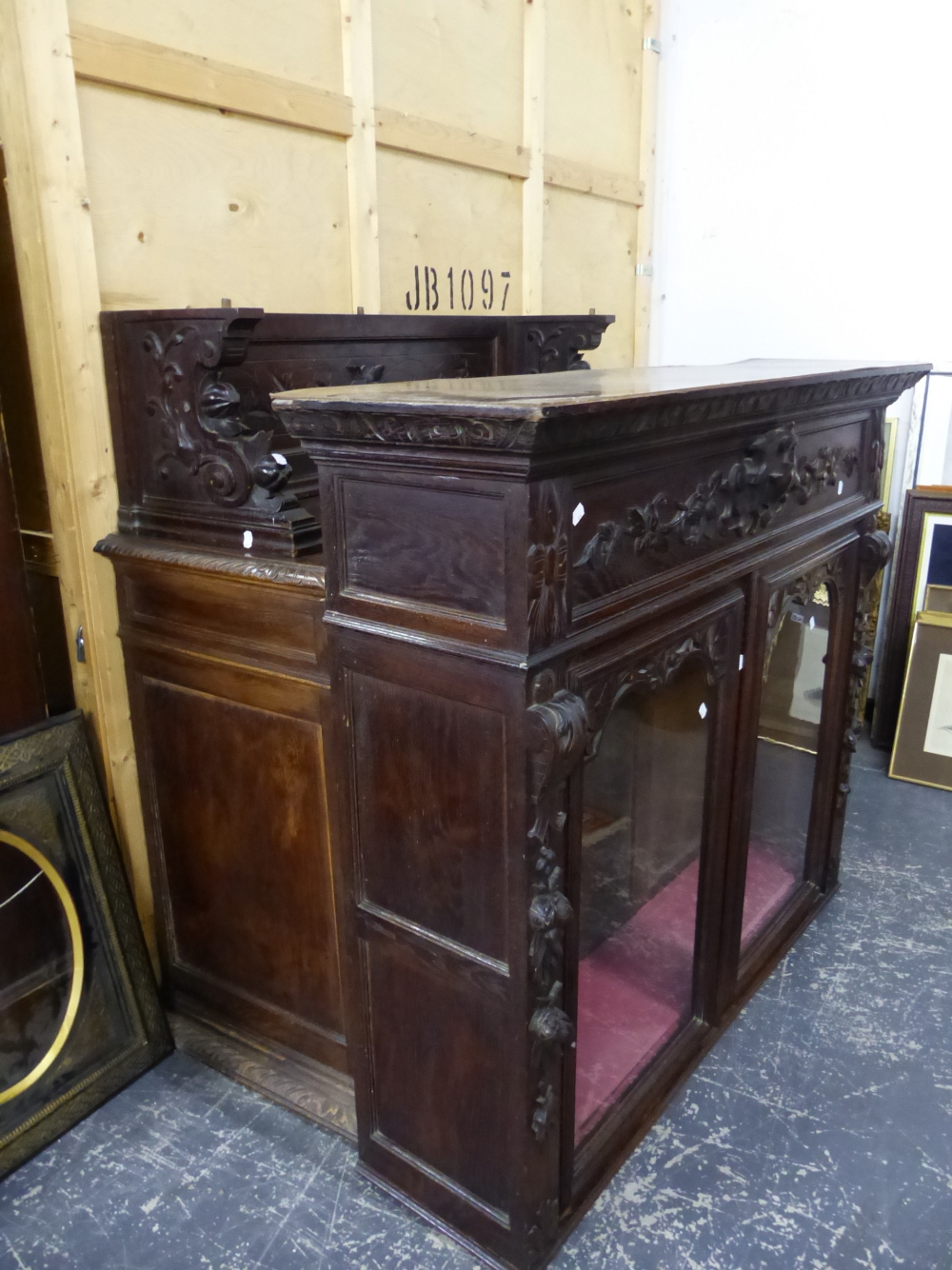 A LARGE FRENCH CARVED OAK SIDE CABINET.