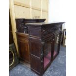 A LARGE FRENCH CARVED OAK SIDE CABINET.