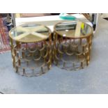 A PAIR OF LAMP TABLES, THE CIRCULAR MIRRORED TOPS ABOVE FOUR BANDS OF GILT METAL HORSESHOE SHAPES.