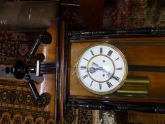 A VIENNA REGULATOR STRIKING ON A COILED ROD, THE ENAMEL DIAL WITH SUBSIDIARY SECONDS HOUSED IN A