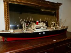 A SCALE MODEL CARGO SHIP AMERICAN SCOUT, PAIRS OF CRANES BESIDE THE FIVE HATCHES, A SINGLE FUNNEL