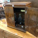 AN ART DECO STYLE WALNET CABINET FITTED FOR THREE DECANTERS INCLUDED.