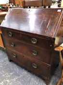 A GEORGIAN OAK SMALL BUREAU.