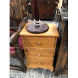 A PINE THREE DRAWER CHEST AND A LAMP.