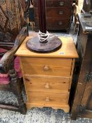 A PINE THREE DRAWER CHEST AND A LAMP.