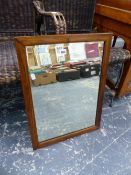 AN OAK FRAMED MIRROR.