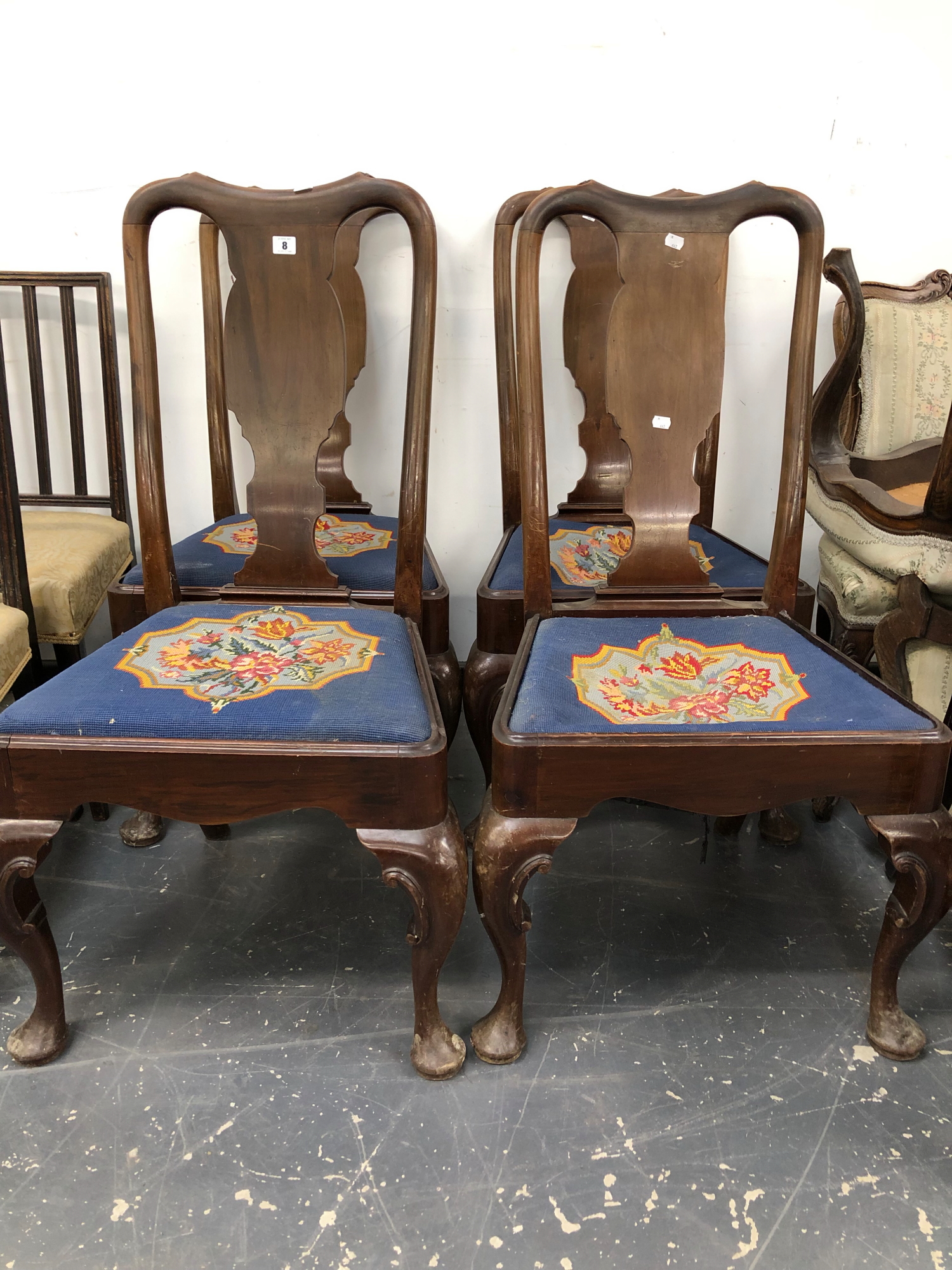 A SET OF FOUR GEORGE I STYLE MAHOGANY SPLAT BACK CHAIRS BY WARING & GILLOW.