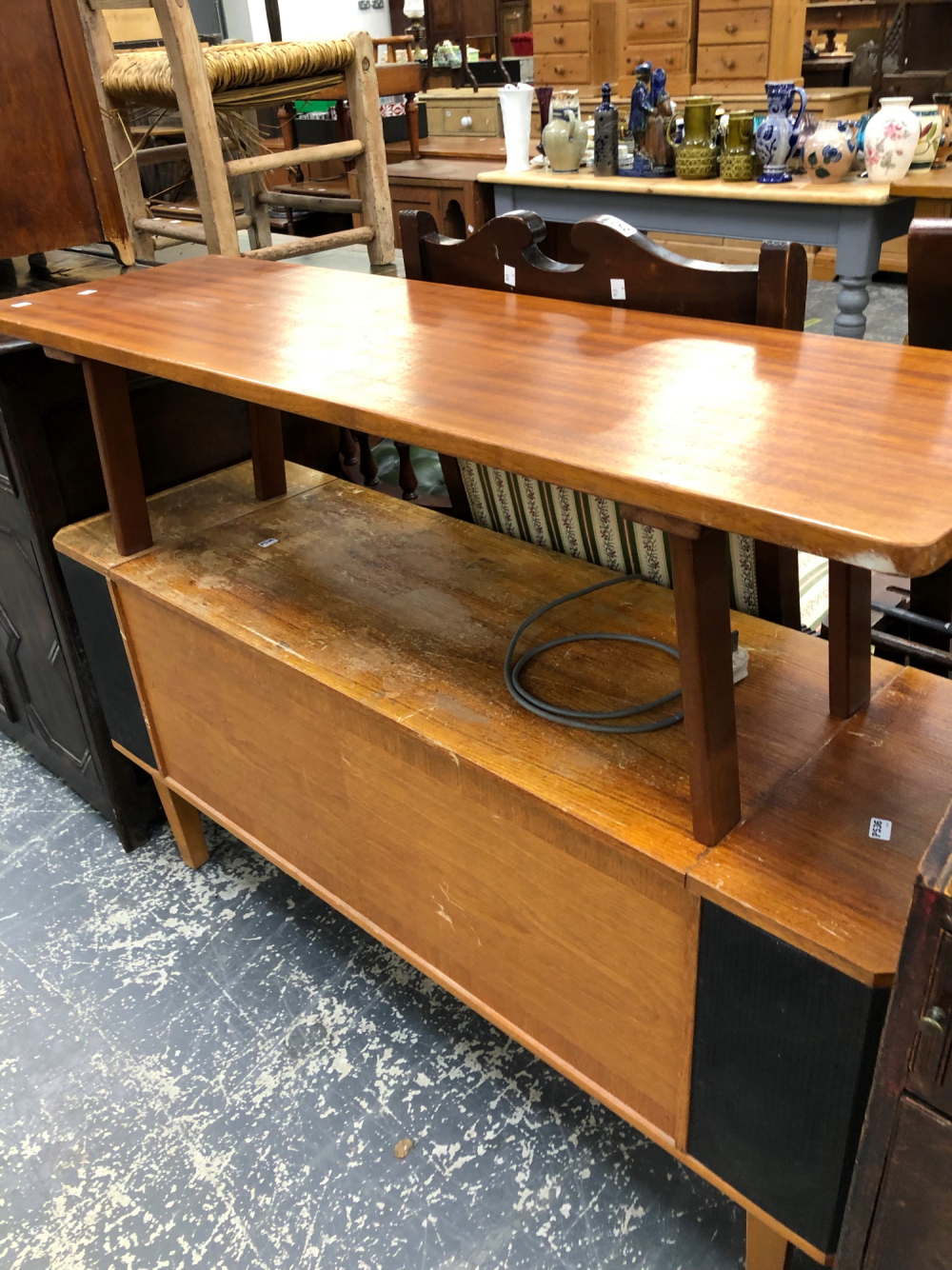 A RETRO TEAK COFFEE TABLE AND A STEREO CABINET.