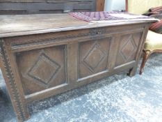 AN 18th C. OAK PANEL FRONT COFFER.