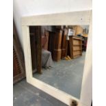 A PAINTED PINE FRAMED MIRROR.